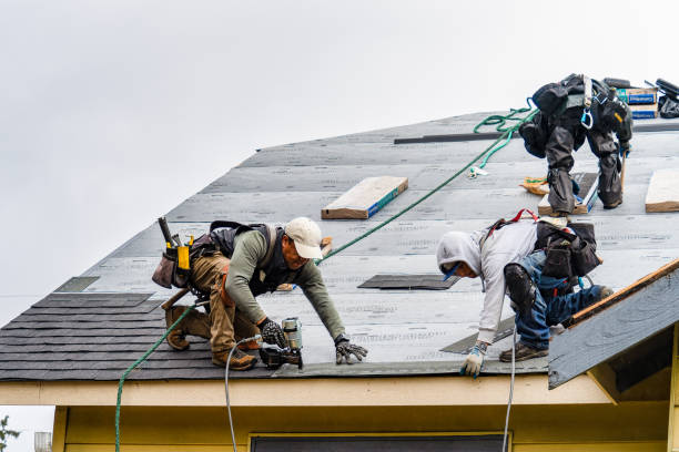 Professional Roofing technician working in Stoneham, MA